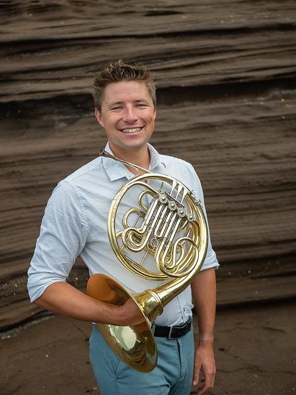 Brian KM smiling with horn