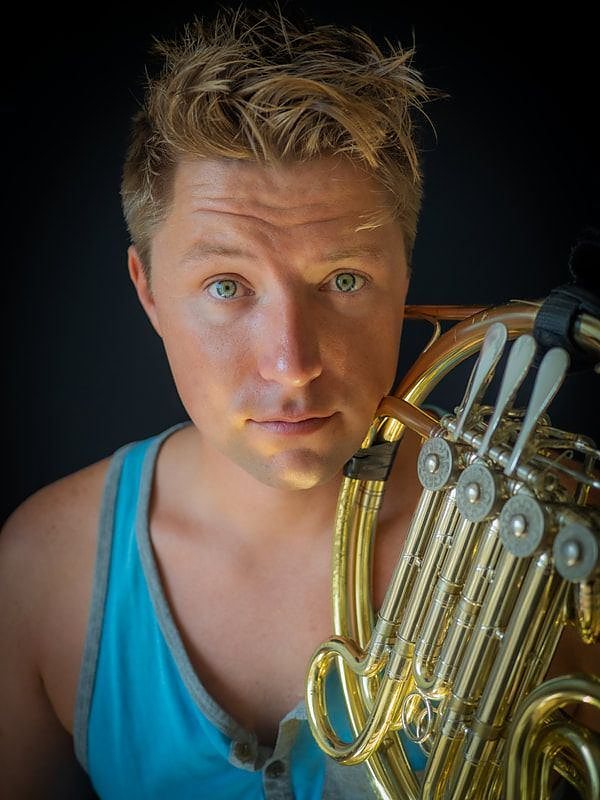 Brian KM portrait with horn