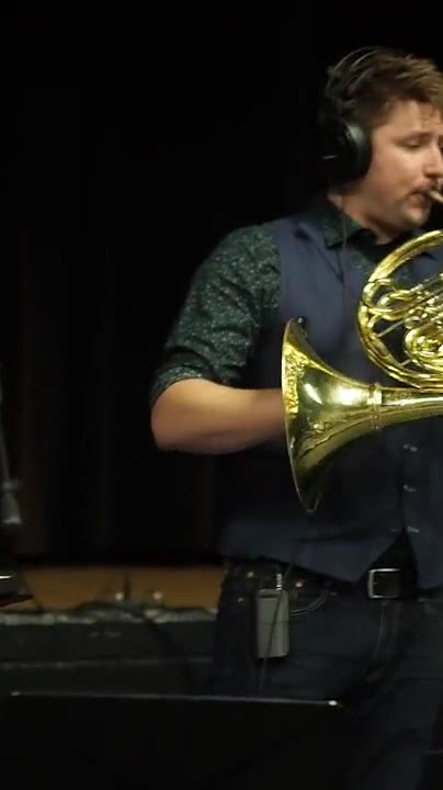 Brian KM performing for high school band students
