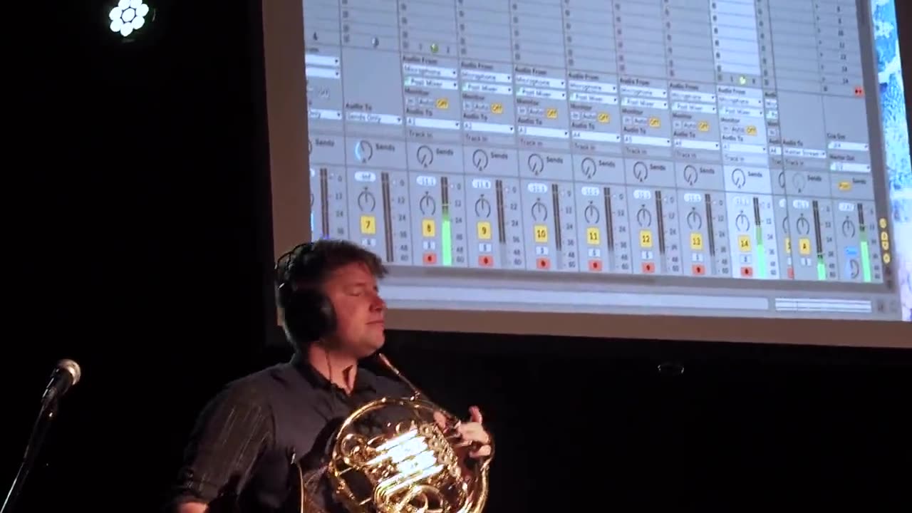 Brian KM performing during a university residency
